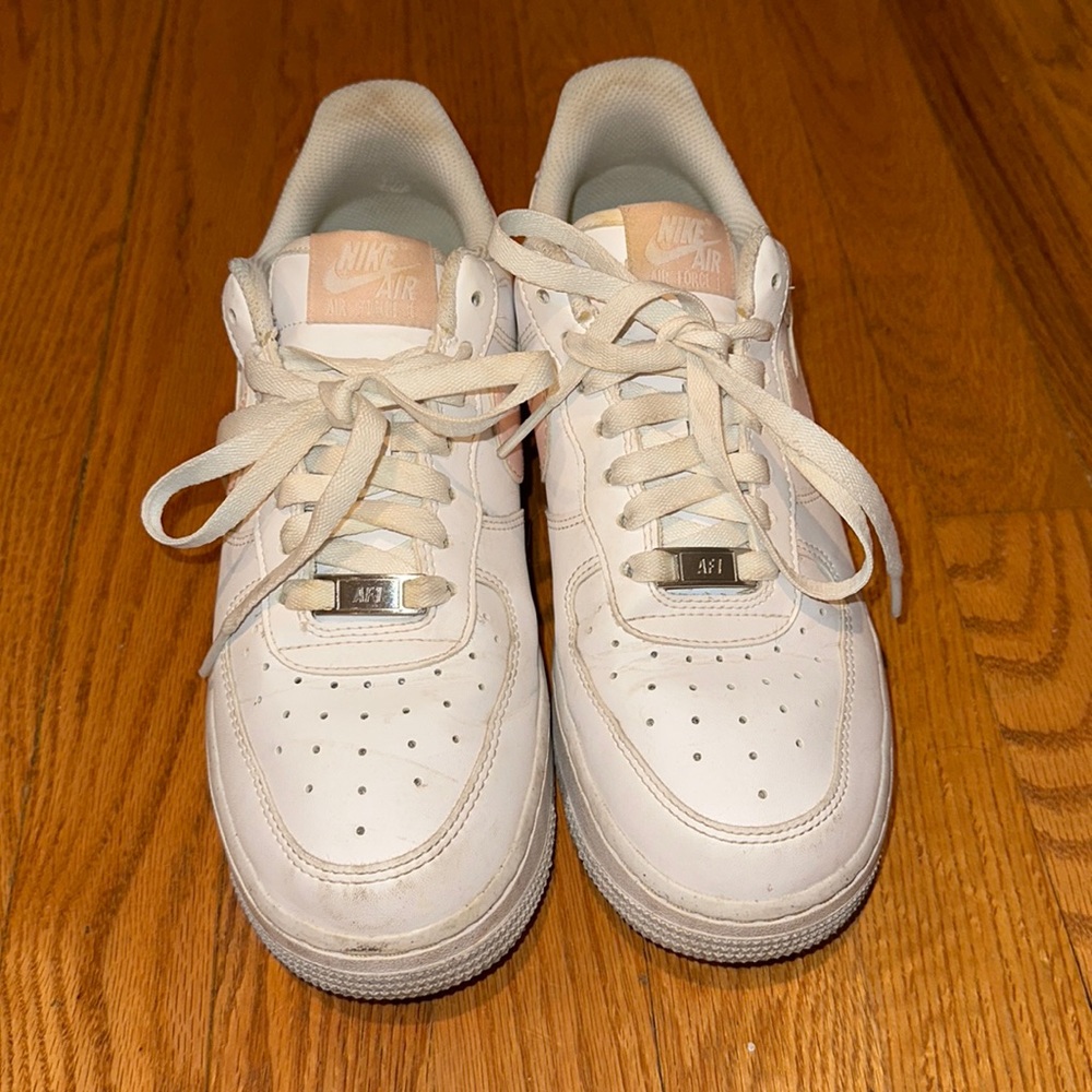 Air Forces with pink swoosh